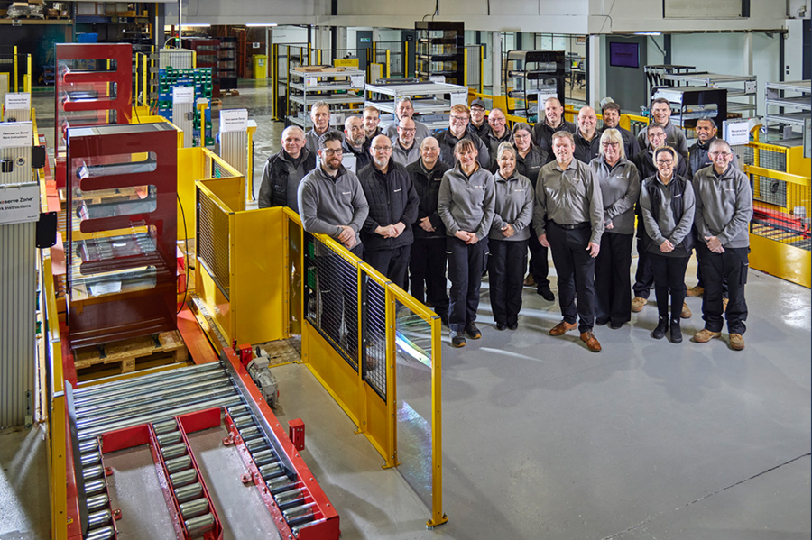 Members of the Flexeserve team next to the newly launched production line where the company's industry-leading hot-holding units are made